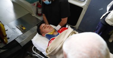 Martin Parra, goalkeeper of Universidad de Chile, leaves the field on a stretcher after being affected by a noise bomb, during the match between U. Catolica and U. de Chile. Valparaiso, Chile, Sept. 28, 2022.  (EPA Photo)