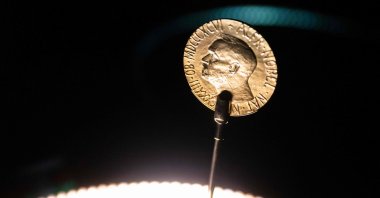 An official Nobel Peace Prize gold medal is seen at the exhibition at the Nobel Peace Center in Oslo, Norway, Dec. 9, 2021. (AFP Photo)