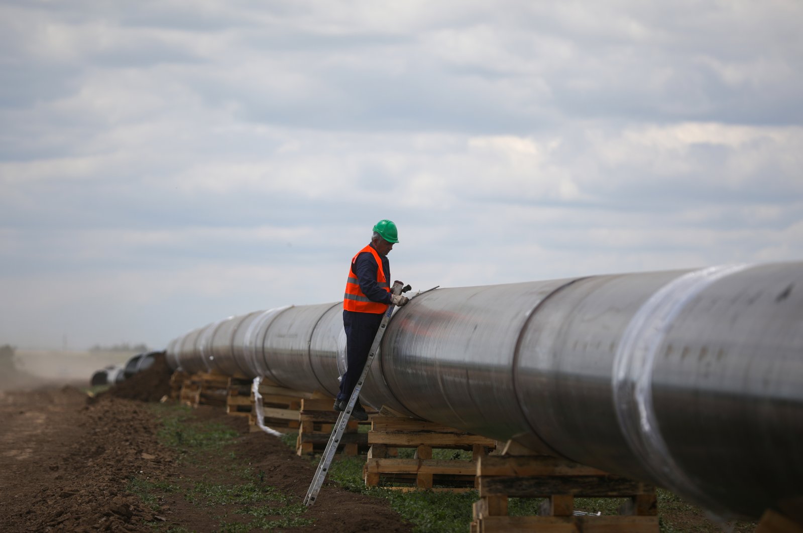 A worker is seen next to a pipe at a construction site on the extension of Russia&#039;s TurkStream gas pipeline, in Letnitsa, Bulgaria, June 1, 2020. (Reuters Photo)