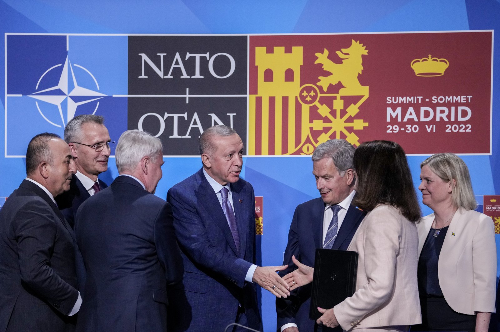 President Recep Tayyip Erdoğan shakes hands with Sweden&amp;#039;s Foreign Minister Ann Linde next to NATO Secretary-General Jens Stoltenberg (2nd L), Finland&amp;#039;s President Sauli Niinisto (3rd R) and Sweden&amp;#039;s Prime Minister Magdalena Andersson after signing a memorandum in which Türkiye agrees to Finland and Sweden&amp;#039;s NATO membership, in Madrid, Spain, June 28, 2022. (AP Photo)