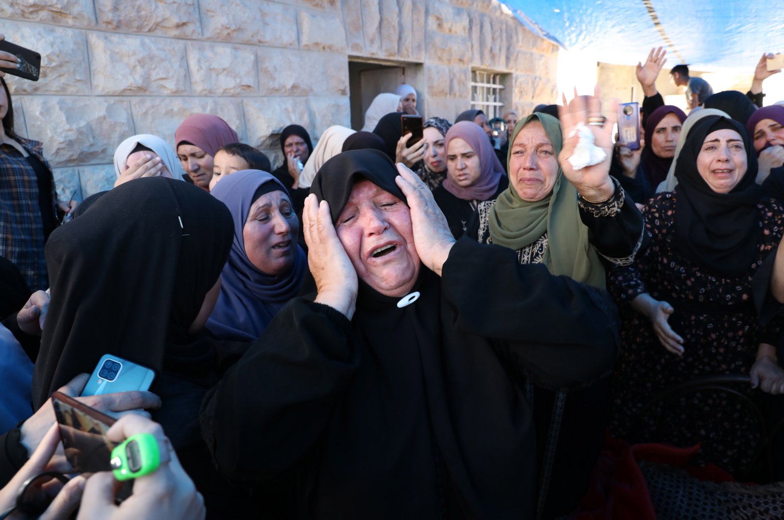 Mourners react during the funeral procession for young Rayyan Suleiman in east Bethlehem, occupied West Bank, Palestine, Sept. 30, 2022. (EPA Photo)