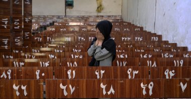 A 19-year old Hazara Afghan girl cries on the bench she was sitting on, during Friday's suicide bomber attack on a Hazara education center, in Kabul, Afghanistan, Oct. 1, 2022. (AP Photo)