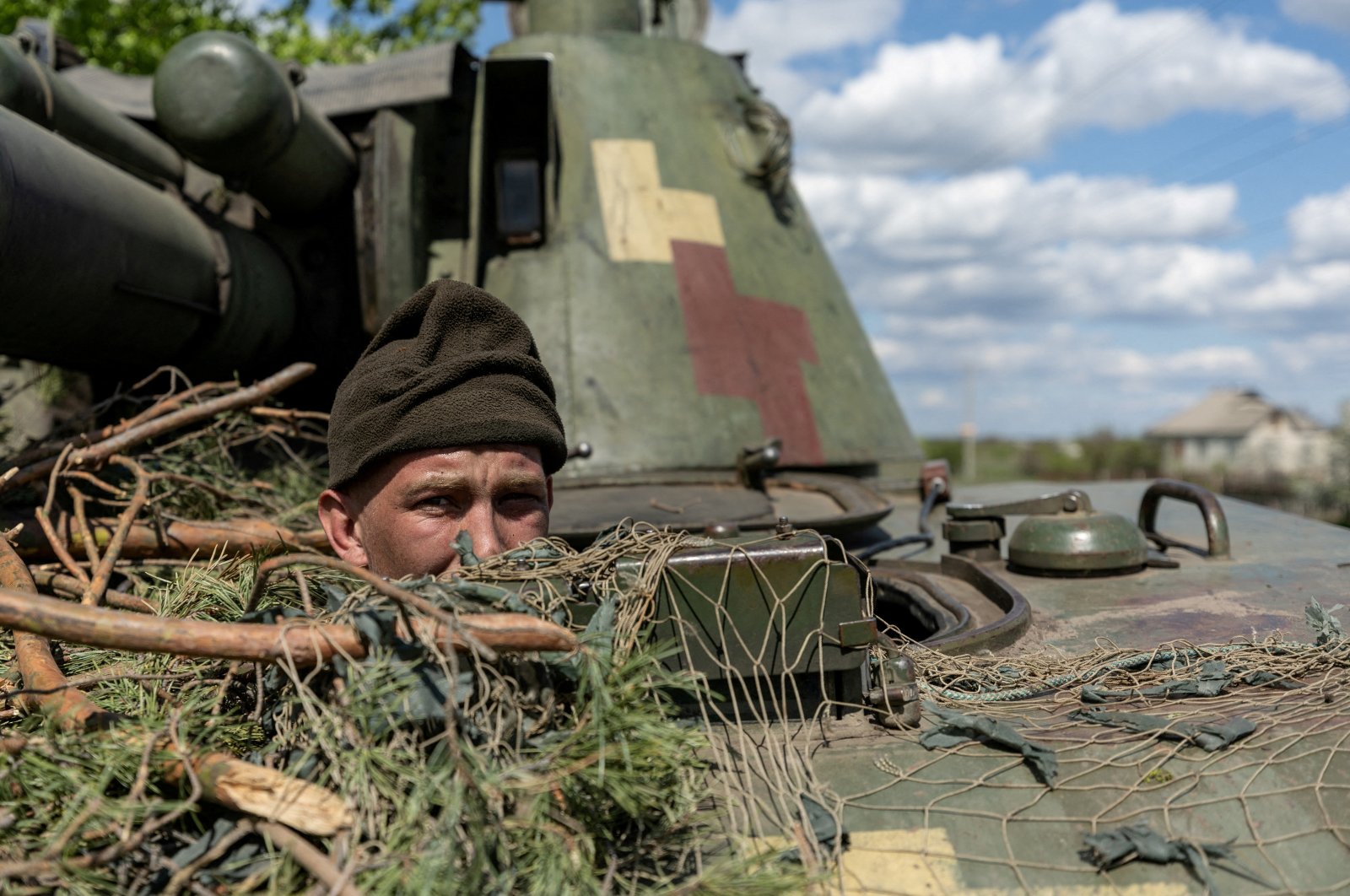 A Ukrainian soldier looks out from a tank, amid Russia&#039;s invasion of Ukraine, in the frontline city of Lyman, Donetsk region, Ukraine, April 28, 2022. (Reuters Photo)