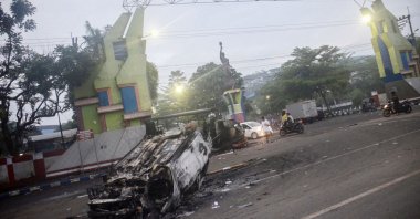 A torched car outside Kanjuruhan stadium in Malang, East Java, Indonesia, Oct. 2, 2022. (AFP Photo)