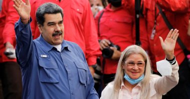 Venezuela's President Nicolas Maduro and his wife Cilia Flores wave to the crowd during a government rally to mark Youth Day, in Caracas, Venezuela, Feb. 12, 2022. (Reuters Photo)