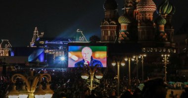 Russian President Vladimir Putin is seen on a screen during the broadcast of a concert marking the declared annexation of the Russian-controlled territories of Ukraine&#039;s four regions, after holding what Russian authorities called referendums in the occupied areas of Ukraine that were condemned by Kyiv and governments worldwide, near St. Basil&#039;s Cathedral and Red Square in central Moscow, Russia, Sept. 30, 2022. (Reuters Photo)