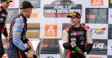 Estonia&#039;s Ott Tanak (L) and Finland&#039;s Kalle Rovanpera celebrate on the podium of the Rally New Zealand, the 11th round of the FIA World Rally Championship, at Jacks Ridge in the outskirts, Auckland, New Zealand, Oct. 2, 2022. (AFP Photo)