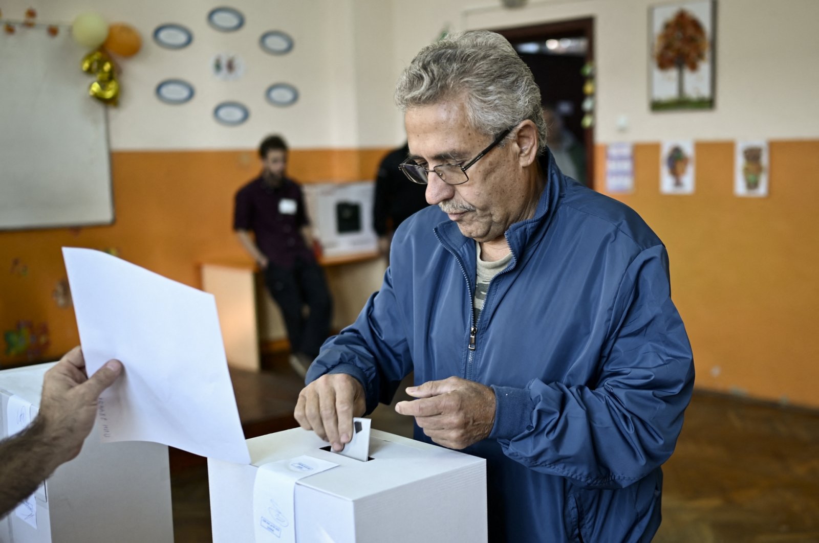 A man casts his ballot at a polling station during Bosnia-Herzegovina&#039;s parliamentary elections, Sofia, Oct. 2, 2022. (AFP Photo)