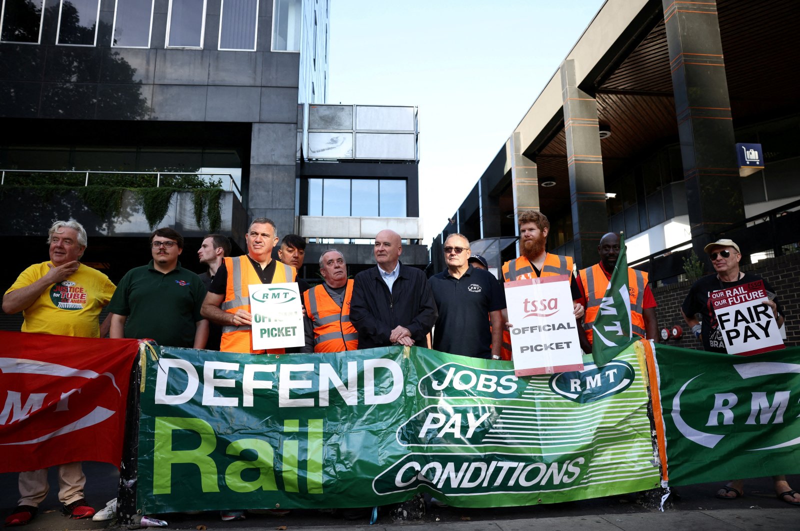 Mick Lynch, general secretary of the National Union of Rail, Maritime and Transport Workers, joins other union members on strike at a picket line outside Euston railway station in London, Britain, Aug. 20, 2022. (Reuters Photo)