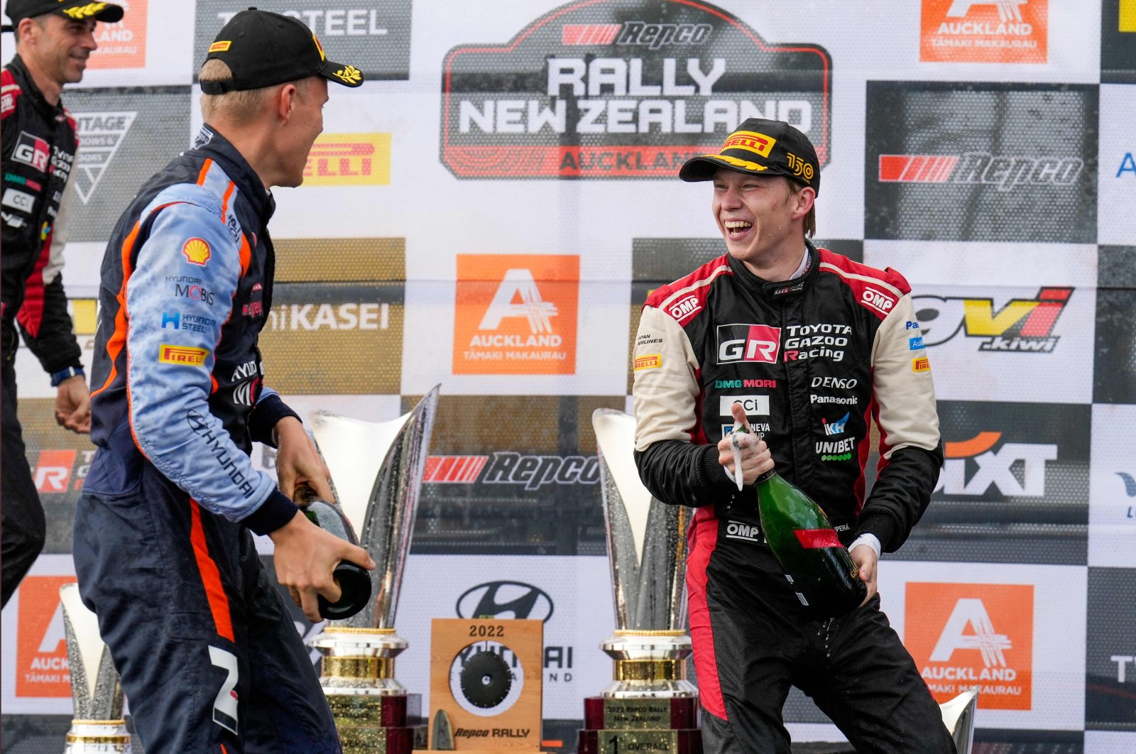 Estonia&#039;s Ott Tanak (L) and Finland&#039;s Kalle Rovanpera celebrate on the podium of the Rally New Zealand, the 11th round of the FIA World Rally Championship, at Jacks Ridge in the outskirts, Auckland, New Zealand, Oct. 2, 2022. (AFP Photo)