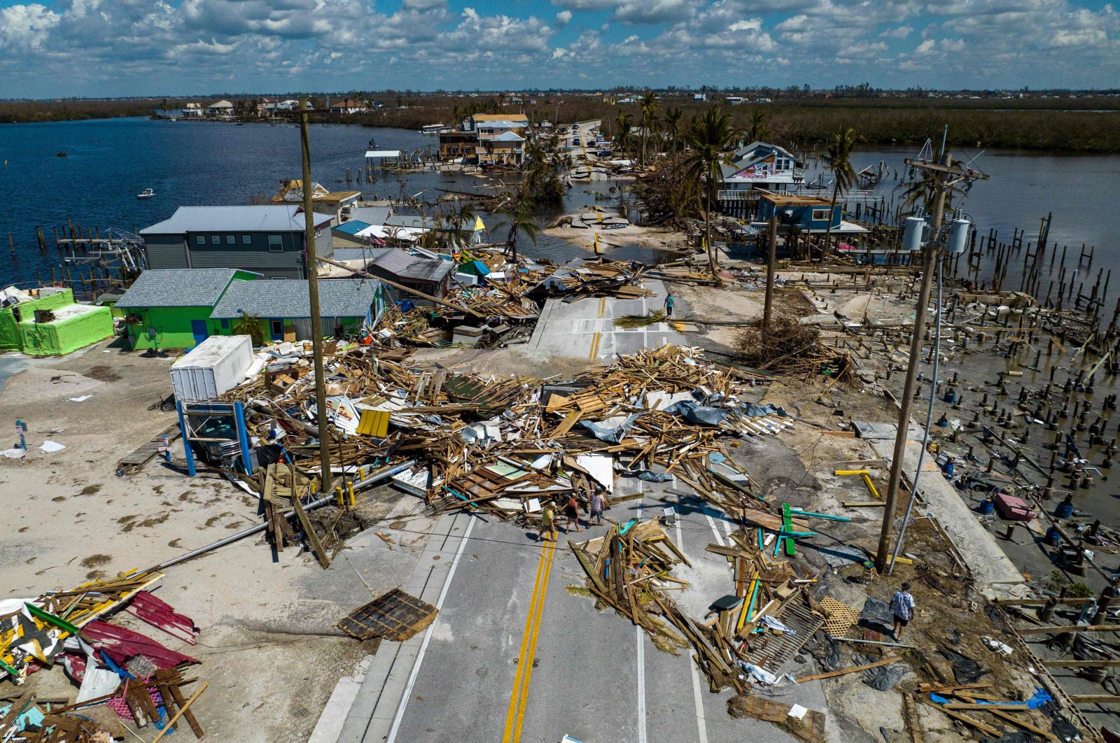 An aerial picture shows a broken section of the Pine Island Road, debris and destroyed houses in the aftermath of Hurricane Ian in Matlacha, Florida, U.S., Oct. 1, 2022. (AFP Photo)
