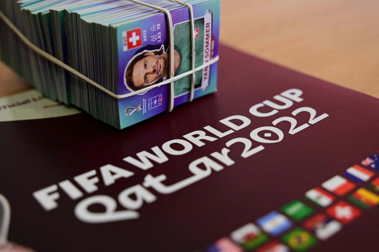 View of a Panini World Cup football album and stickers in Santiago, Chile, Sept. 23, 2022. (AFP Photo)