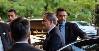 Azerbaijan's Foreign Minister Jeyhun Bayramov (C) arrives at the Hotel InterContinental for a meeting with his Armenian counterpart in Geneva, Switzerland, Oct. 2, 2022 (AFP Photo)