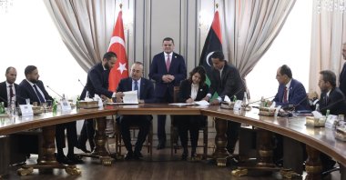 Leader of the Tripoli-based unity government and Prime Minister Abdul Hamid Mohammed Dbeibah (top C) oversees signing of agreements between Türkiye and Libya by Foreign Minister Mevlüt Çavuşoğlu (4th L) and Libyan Foreign Minister Najla Mangoush (4th R), in the capital Tripoli, Libya, Oct. 3, 2022.