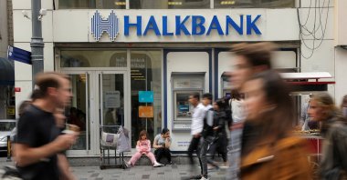 People walk past a branch of Halkbank in central Istanbul, Türkiye, Oct. 16, 2019. (Reuters File Photo)