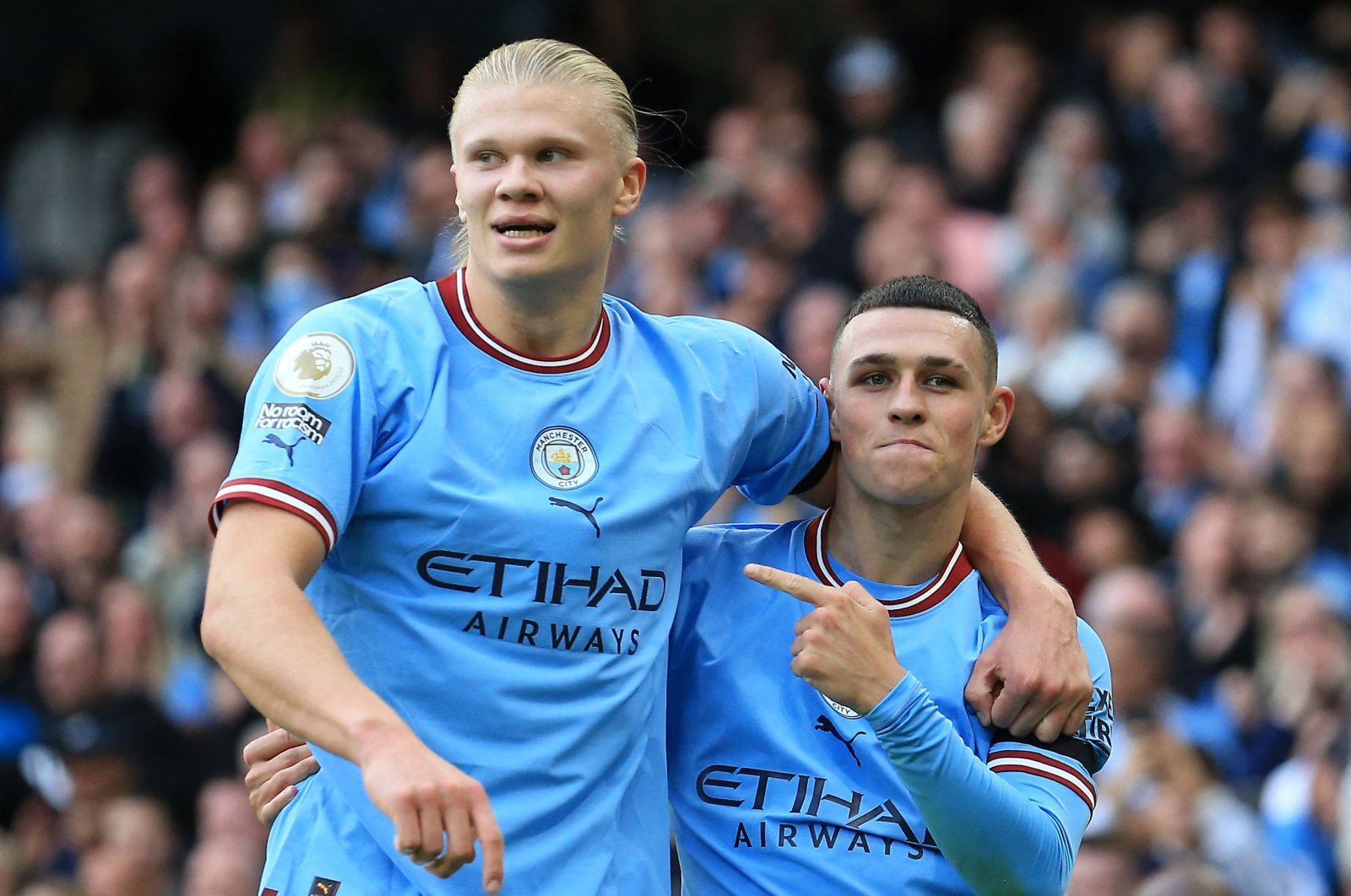Phil Foden (R) celebrates scoring his team&#039;s sixth goal and his third with Erling Haaland (L) during the English Premier League match between Manchester City and Manchester United at the Etihad Stadium, Manchester, North West England, Oct. 2, 2022