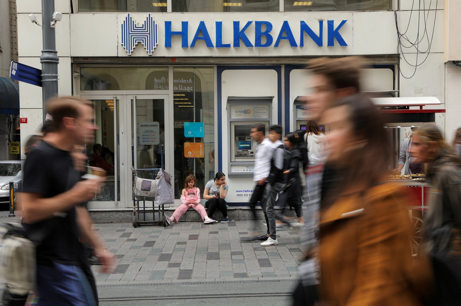 People walk past a branch of Halkbank in central Istanbul, Türkiye, Oct. 16, 2019. (Reuters File Photo)