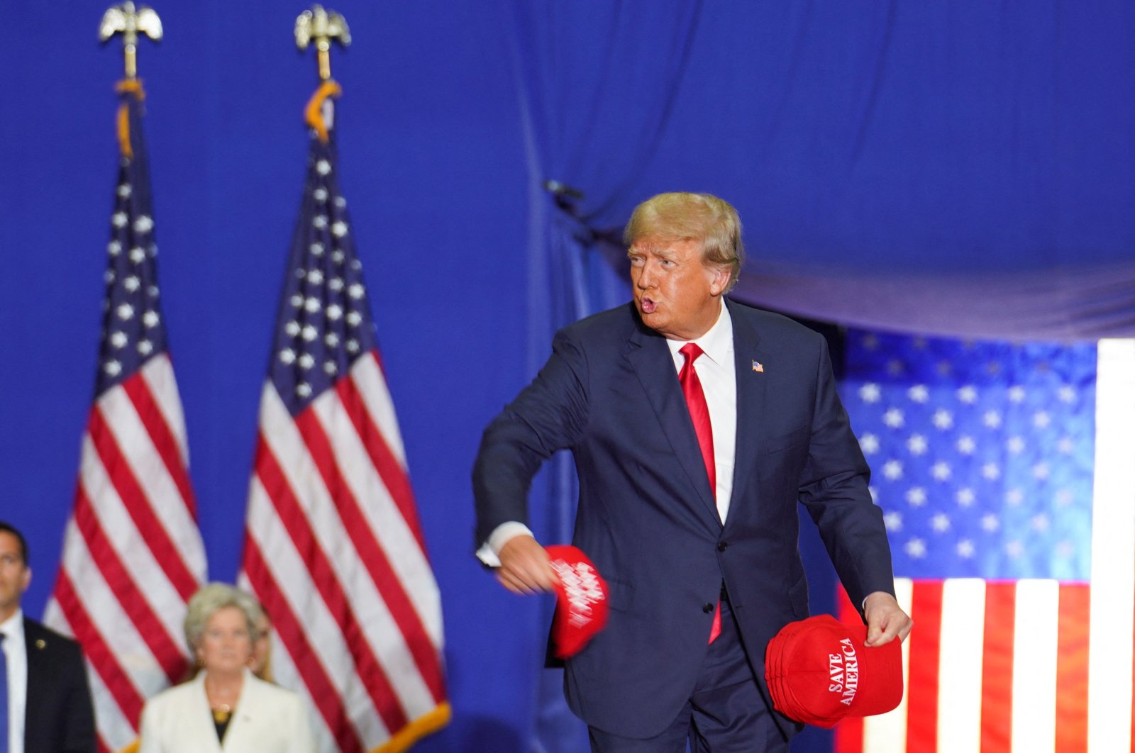 Former U.S. President Donald Trump throws a "Save America" cap as he attends a rally in Warren, Michigan, U.S., Oct. 1, 2022. (Reuters Photo)