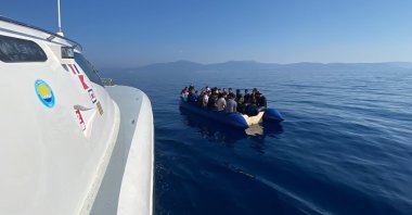 A Turkish coast guard boat approaches a migrant boat, in Izmir, western Türkiye, Sept. 6, 2022. (AA Photo)