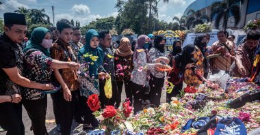 People pay their respects to the victims of the stampede at Kanjuruhan stadium, Malang, East Java, Indonesia, Oct. 4, 2022. (AFP Photo)
