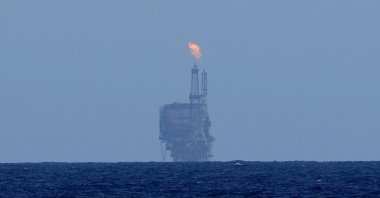 An oil platform is visible on the horizon in the international waters zone near Libya in the Mediterranean Sea, Sept. 17, 2022. (AP Photo)