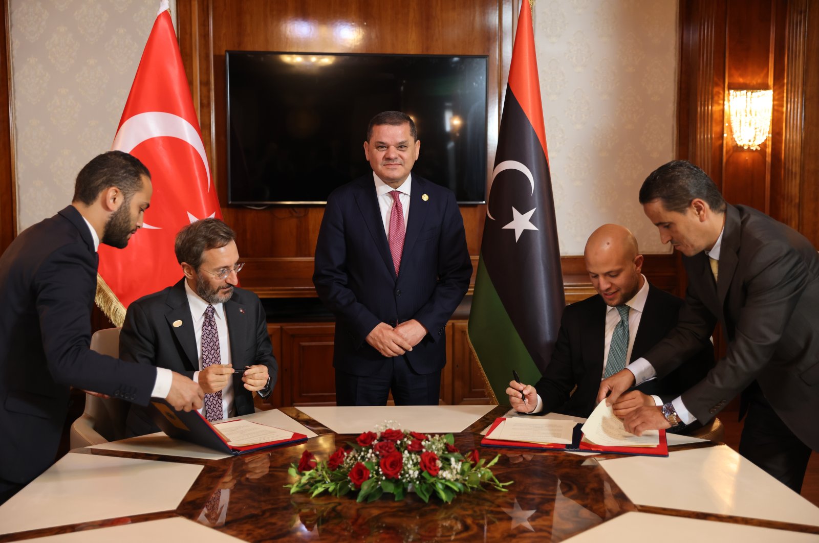 Türkiye&#039;s communications chief Fahrettin Altun (2nd L) and Libyan State Minister for Communication and Political Affairs Walid al-Lafi (2nd R) sign an agreement on media in Tripoli, Libya, Oct. 3, 2022 (AA Photo)