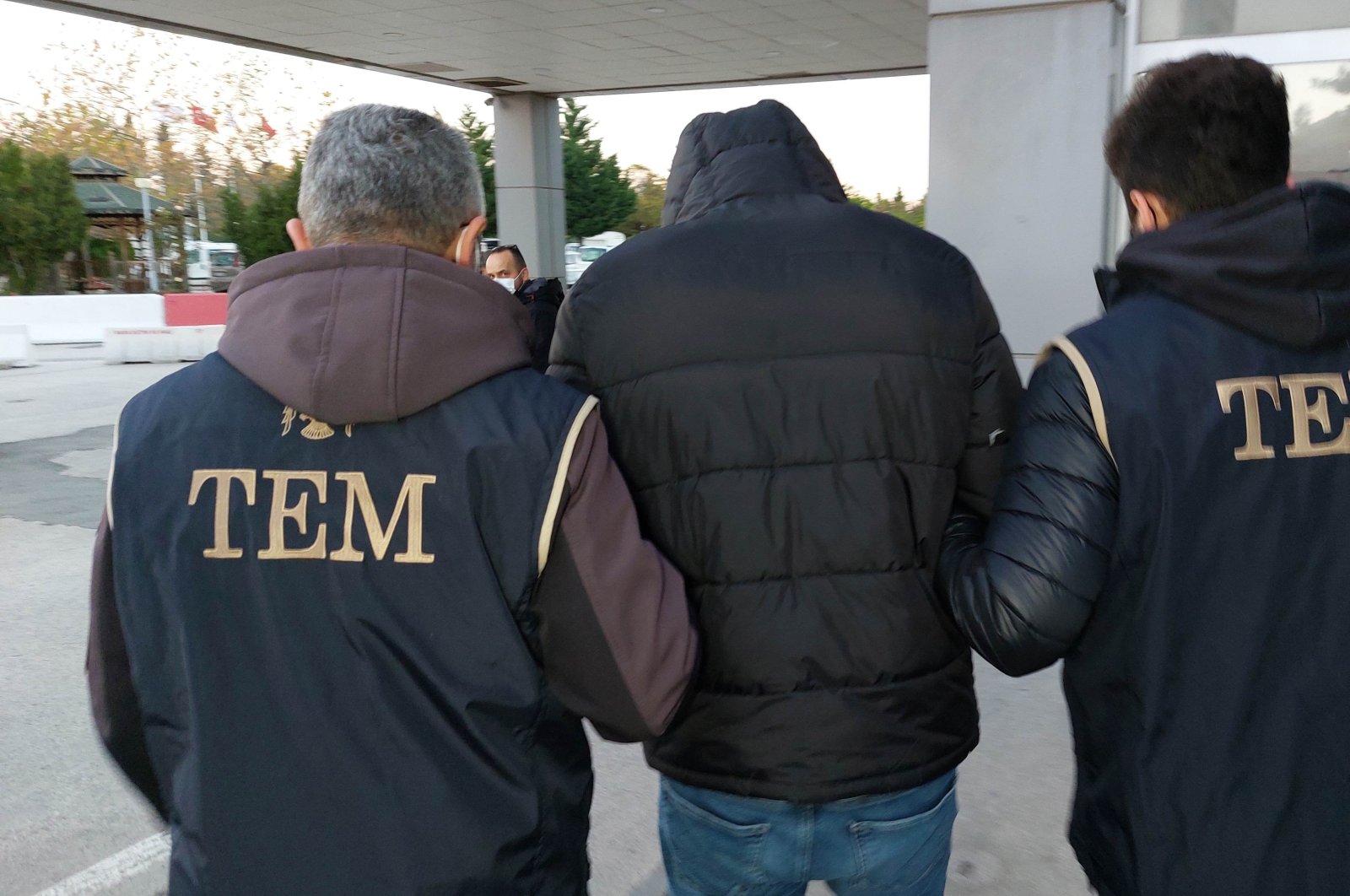 Police escort a captured FETÖ suspect in Samsun, northern Türkiye, Nov. 27, 2021. (İHA Photo)