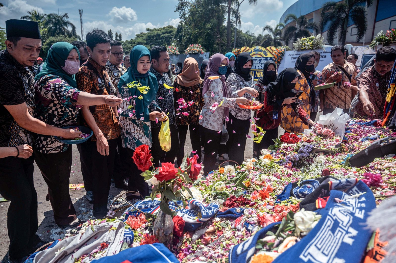 People pay their respects to the victims of the stampede at Kanjuruhan stadium, Malang, East Java, Indonesia, Oct. 4, 2022. (AFP Photo)