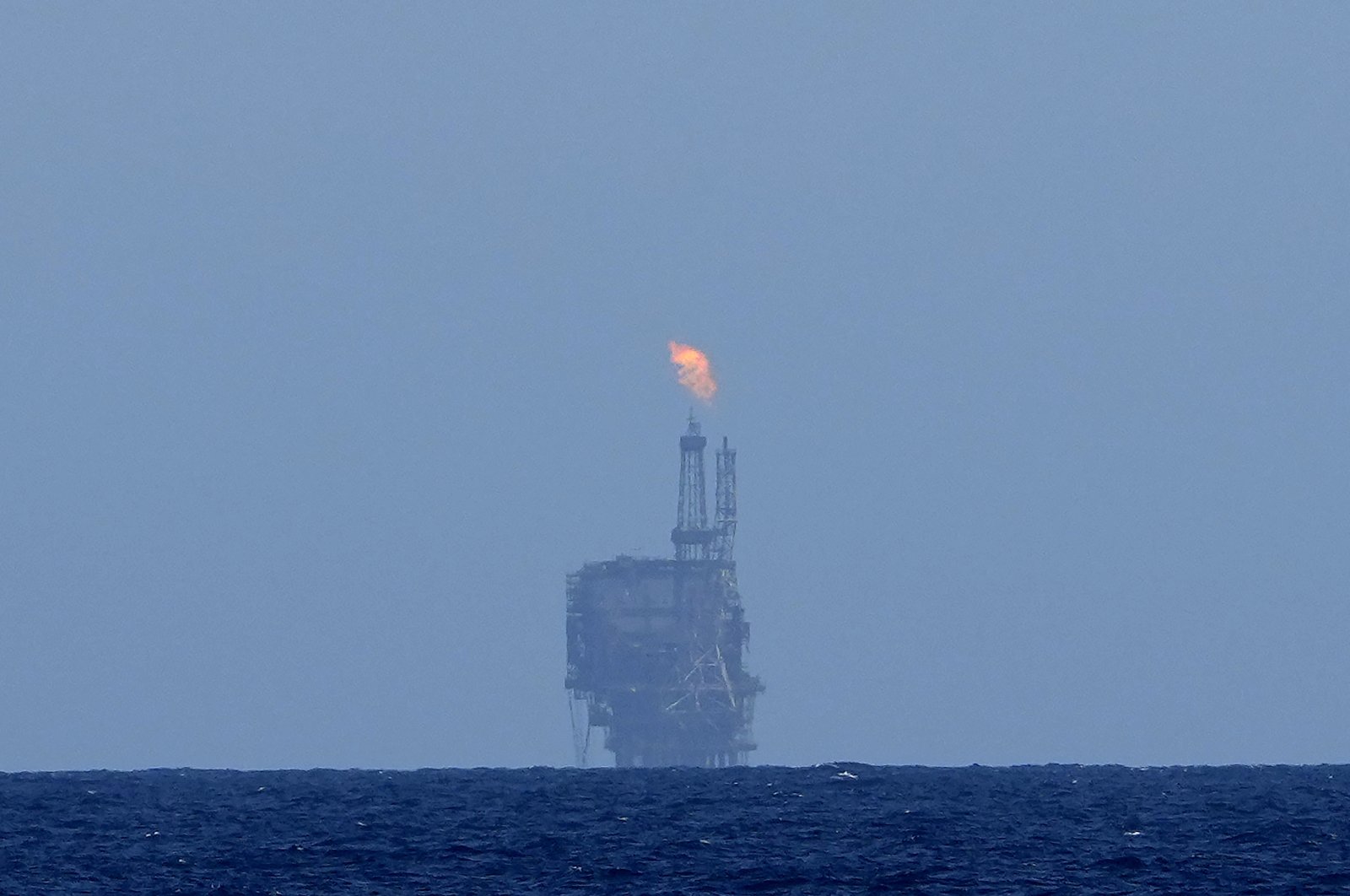An oil platform is visible on the horizon in the international waters zone near Libya in the Mediterranean Sea, Sept. 17, 2022. (AP Photo)