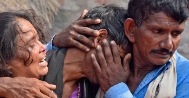 Villagers weep next to the bodies of their relatives who died in a road accident, Kanpur, India, Oct. 2, 2022. (AFP Photo)