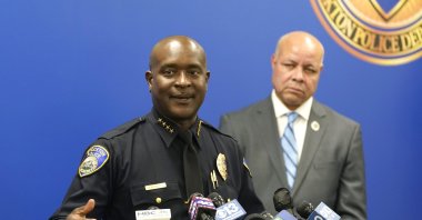 Stockton Police Chief Stanley McFadden, left, flanked by Stockton City Manager Harry Black, right, updates reporters about the investigation into the shooting deaths of six men and one woman during a news conference. Stockton, California, Oct. 4, 2022. (AP Photo)
