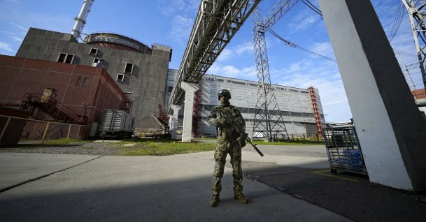A Russian soldier guards an area of the Zaporizhzhia Nuclear Power Station in territory under Russian military control, southeastern Ukraine, May 1, 2022. (AP Photo)