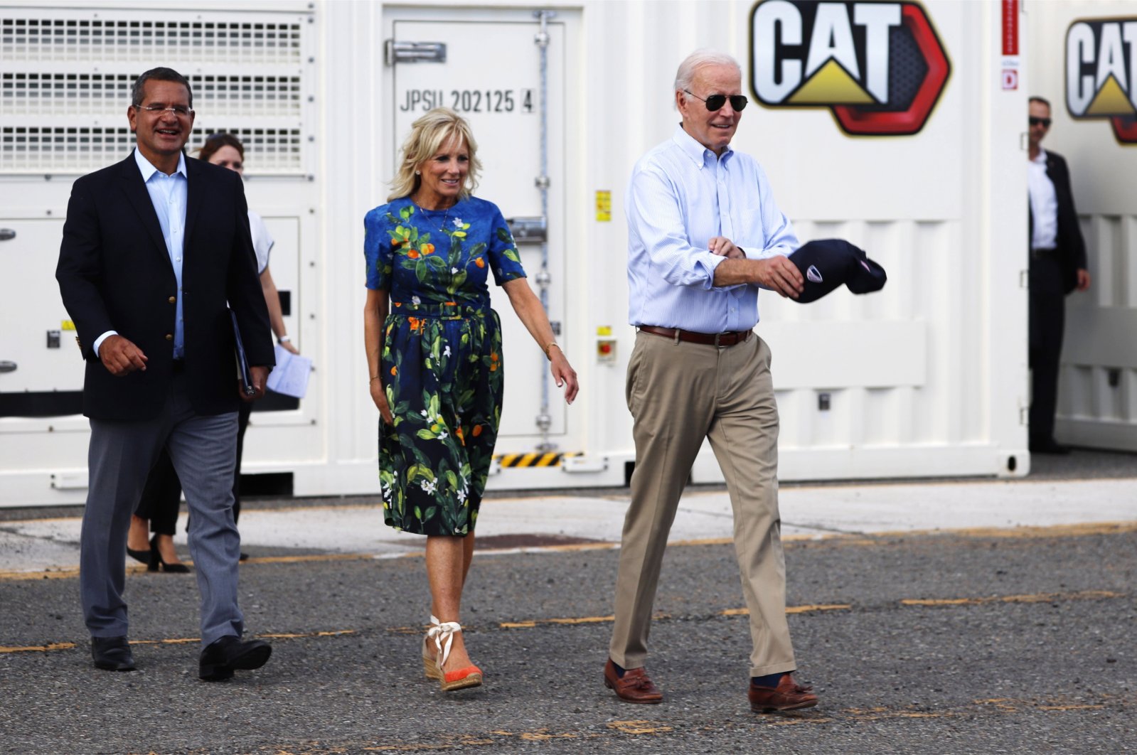 U.S. President Joe Biden (R) walks with first lady Jill Biden (C) and the governor of Puerto Rico, Pedro Pierluisi, during an official visit to inspect damage from Hurricane Fiona. Ponce, Puerto Rico, Oct. 3, 2022. (EPA Photo)