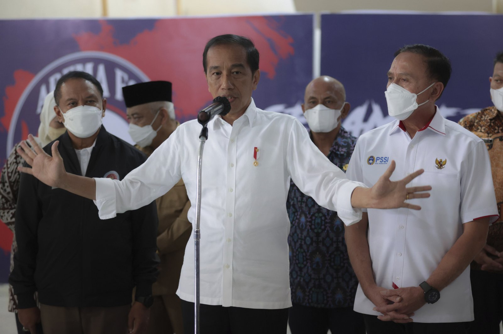 Indonesian President Joko Widodo speaks to the media during a press conference at Kanjuruhan Stadium, where a soccer stampede killed more than 100 people, Malang, East Java, Indonesia, Oct. 5, 2022.  (AP Photo)