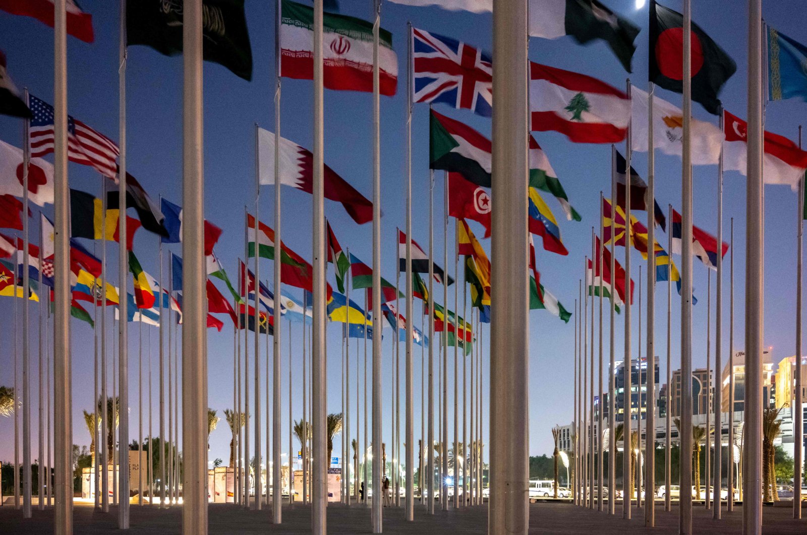 Flags representing nations with diplomatic missions accredited by the state of Qatar fly at Flag Plaza in the capital Doha, Oct. 4, 2022, ahead of the FIFA 2022 World Cup football competition. (AFP Photo)