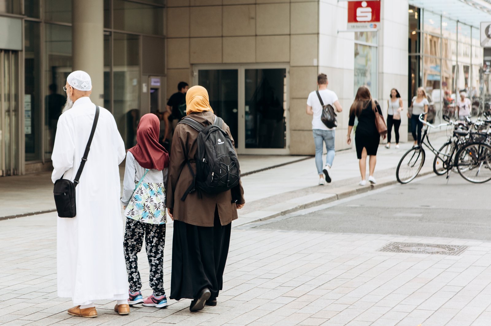 A family of tourists or migrants walking along the street in Leipzig, Germany, Sept. 6, 2018. (Shutterstock File Photo)
