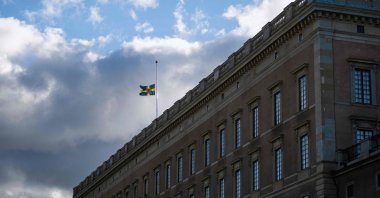 The Swedish flag flies at half-mast atop the Royal Palace in Stockholm, Sweden, Sept. 9, 2022. (AFP Photo)