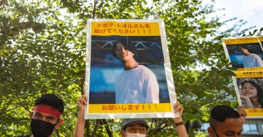 A group of activists holding up placards with images of Japanese citizen Toru Kubota, who was detained in Myanmar, during a rally in front of the Ministry of Foreign Affairs,Tokyo, Japan, July 31, 2022 (AFP Photo)