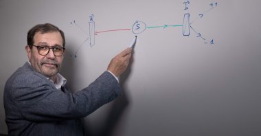 French physicist and co-recipient of the Nobel Physics Prize, Alain Aspect, shows the Aspect plan at the Institut d'Optique graduate school in Palaiseau, Paris, France, Oct. 5, 2022. (AFP Photo)