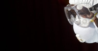 In this Oct. 8, 2014, file photo, a medical worker from the Infection Prevention and Control unit wearing full protective equipment prepares to enter an isolation tent housing a man being quarantined after coming into contact in Uganda with a carrier of the Marburg Virus, a hemorrhagic fever from the same family as Ebola, at the Kenyatta National Hospital in Nairobi, Kenya. (AP File Photo)