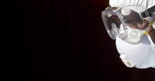 In this Oct. 8, 2014, file photo, a medical worker from the Infection Prevention and Control unit wearing full protective equipment prepares to enter an isolation tent housing a man being quarantined after coming into contact in Uganda with a carrier of the Marburg Virus, a hemorrhagic fever from the same family as Ebola, at the Kenyatta National Hospital in Nairobi, Kenya. (AP File Photo)