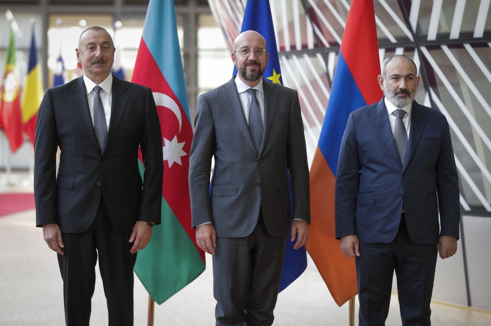 Azerbaijan&#039;s President Ilham Aliyev (L) and Armenia&#039;s Prime Minister Nikol Pashinyan are welcomed by the European Council President Charles Michel (C) in Brussels, Belgium, Aug. 31, 2022. (IHA Photo)