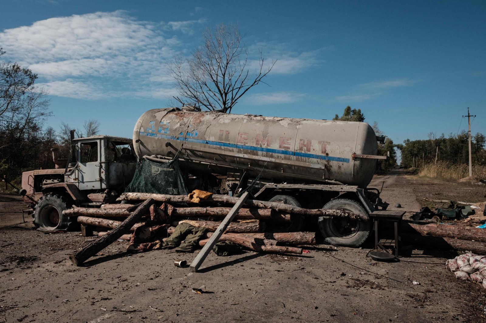 A destroyed oil truck, once used by Russian forces to block a road at a checkpoint during the occupation, is seen near the recently retaken town of Lyman in the Donetsk region, Ukraine, Oct. 6, 2022, amid the Russian invasion of Ukraine. (AFP Photo)