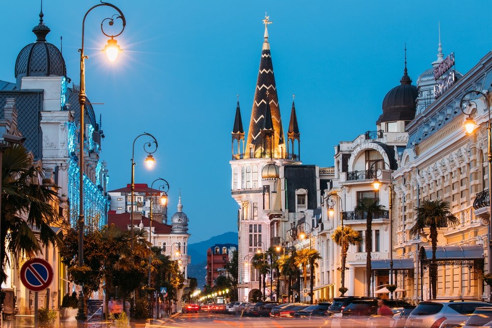 Evening view of former National Bank building with Astronomical Clock on Europe Square, Batumi, Georgia. (Shutterstock Photo)