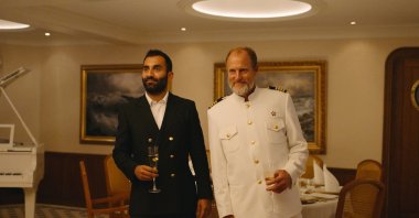 This image released by Neon shows Arvin Kananian (L) and Woody Harrelson in a scene from &quot;Triangle of Sadness.&quot; (AP Photo)