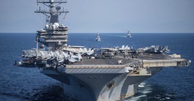 The U.S. aircraft carrier USS Ronald Reagan participates with other U.S. and South Korean naval ships during the joint naval exercises between the United States and South Korea in waters off South Korea's eastern coast, Sept. 29, 2022. (South Korea Navy/Yonhap via AP)