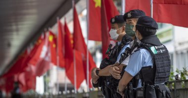 Police officers stand guard during China&#039;s National Day, Hong Kong, China, Oct. 1, 2022. (EPA Photo)