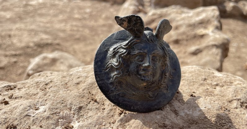 An 1,800-year-old military medal engraved with the head of Medusa in the ancient city of Perre, in Adıyaman, Türkiye, Oct. 5, 2022. (AA Photo)
