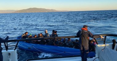 Turkish coast guard units rescue irregular migrants pushed back by Greece in the Aegean Sea, Oct. 4, 2022. (IHA Photo)