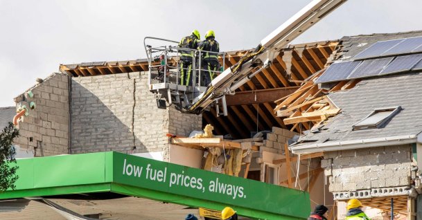 Emergency services inspect the scene following an explosion in Creeslough, northwest Ireland, Oct. 8, 2022. (AFP Photo)